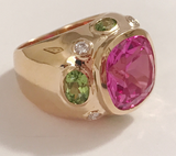 Rose Gold Bezel Set Dark Blue Topaz with Surrounding Pink Sapphire Ring