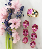 Rose Gold Bezel Set Dark Blue Topaz with Surrounding Pink Sapphire Ring