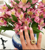 Rose Gold Bezel Set Dark Blue Topaz with Surrounding Pink Sapphire Ring