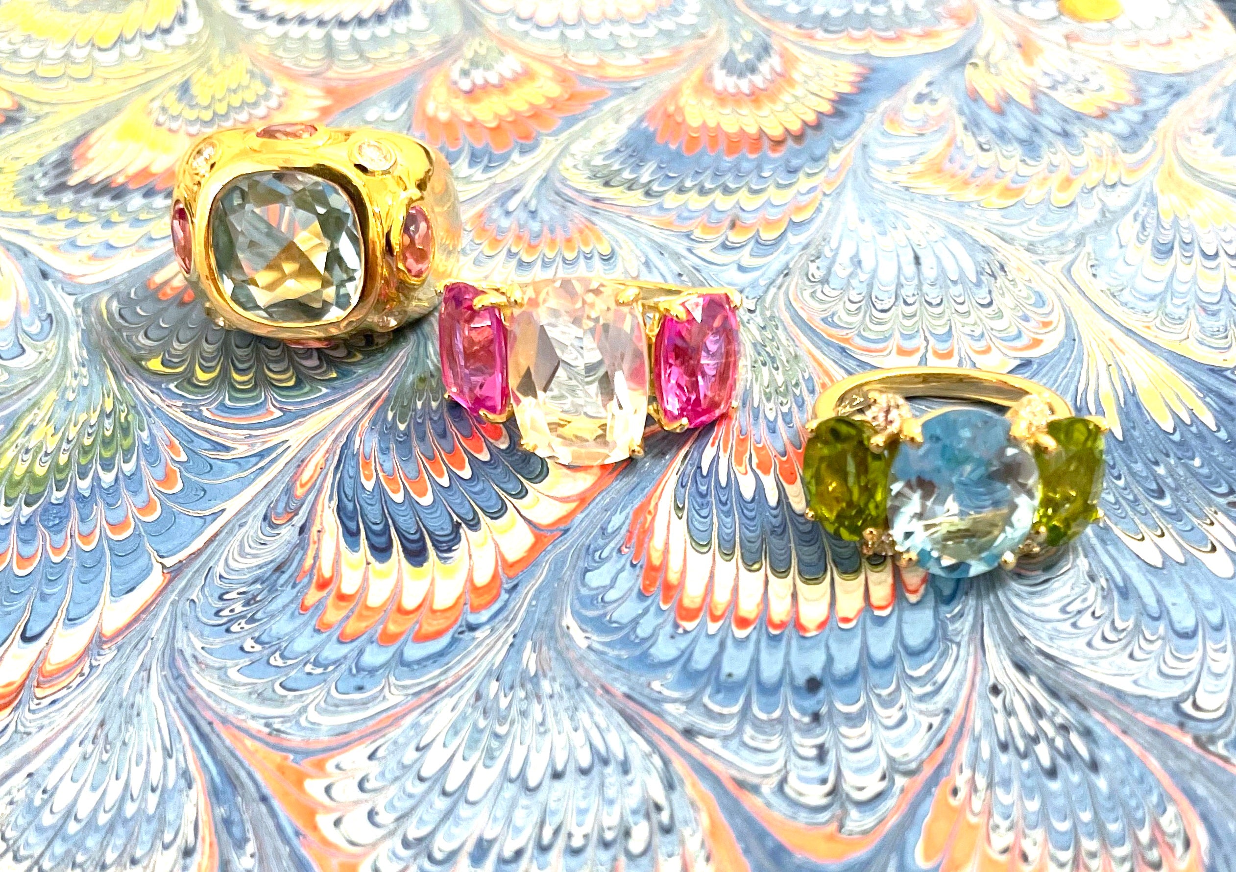 Elegant Three-Stone Ring with Gold Rope Twist Border with Blue Topaz and Pink Topaz