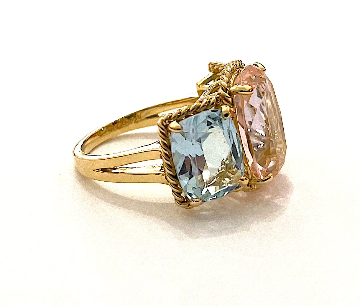 18kt Yellow Gold Three Stone Ring with Pink Topaz and Blue Topaz and Rope Twist Border