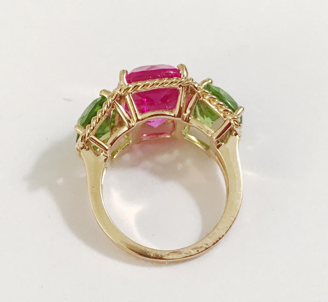 Elegant Three-Stone Ring with Gold Rope Twist Border with Blue Topaz and Pink Topaz